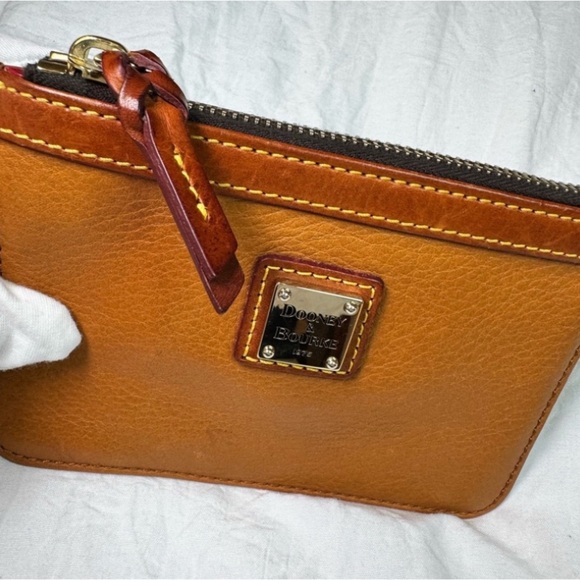 Dooney & Bourke Handbags - Dooney & Bourke Orange and Red Leather Wristlet
